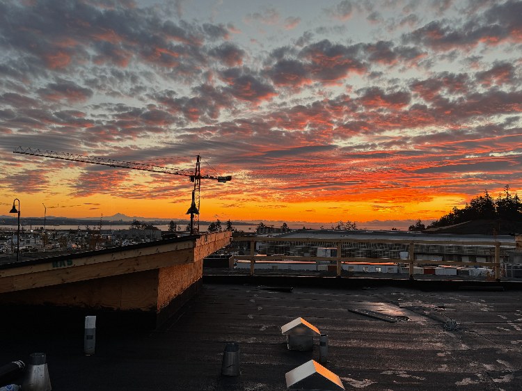 Commercial flat roof job at sunset on Vancouver Island
